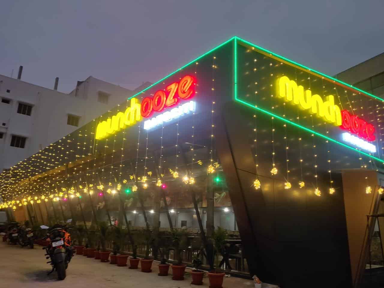 "Cozy and modern interior of Munchooze Restaurant, showcasing stylish decor, warm lighting, and a welcoming dining atmosphere."